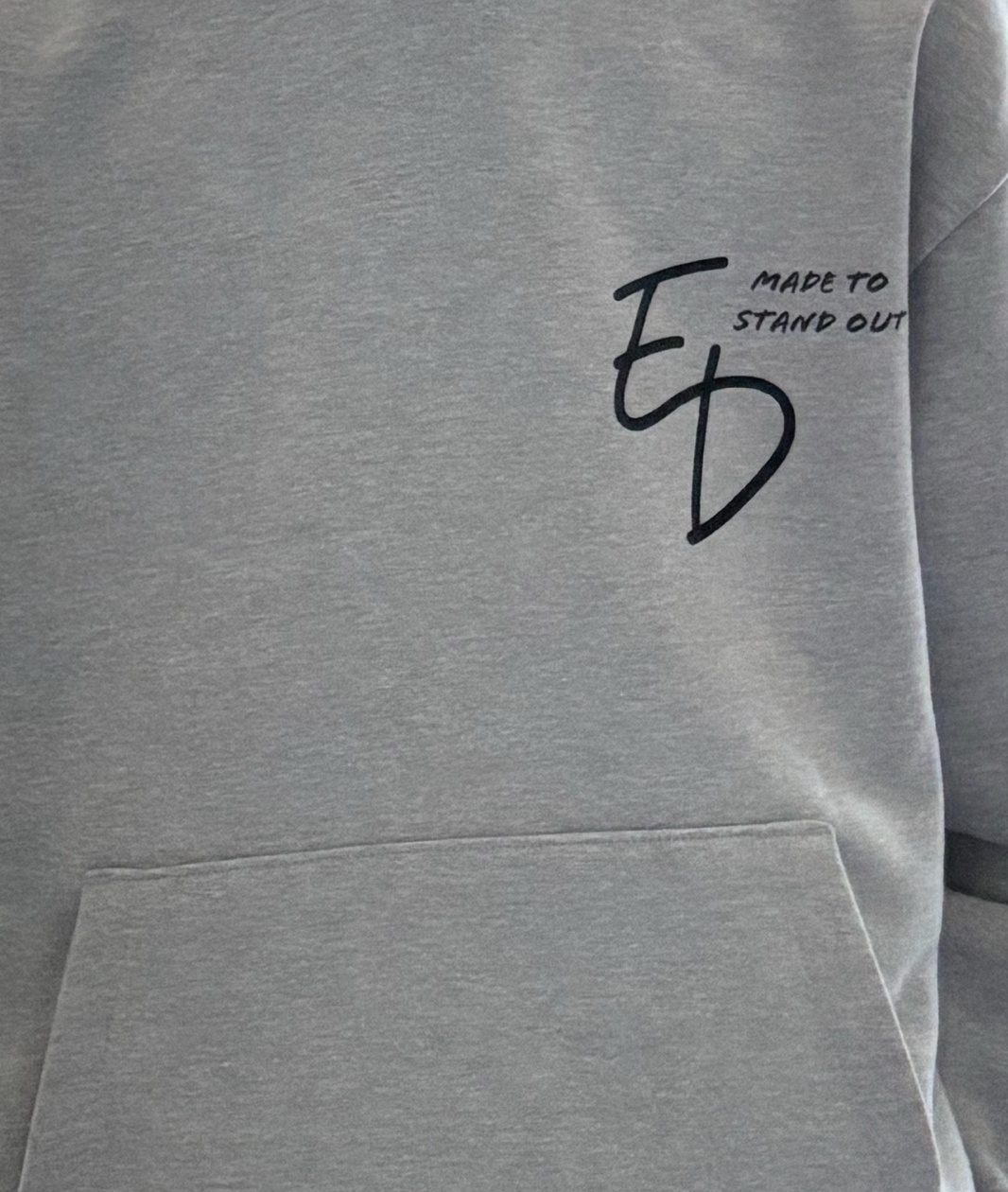 Close-up of the actual ED Made to Stand Out print on the overhead hoodie